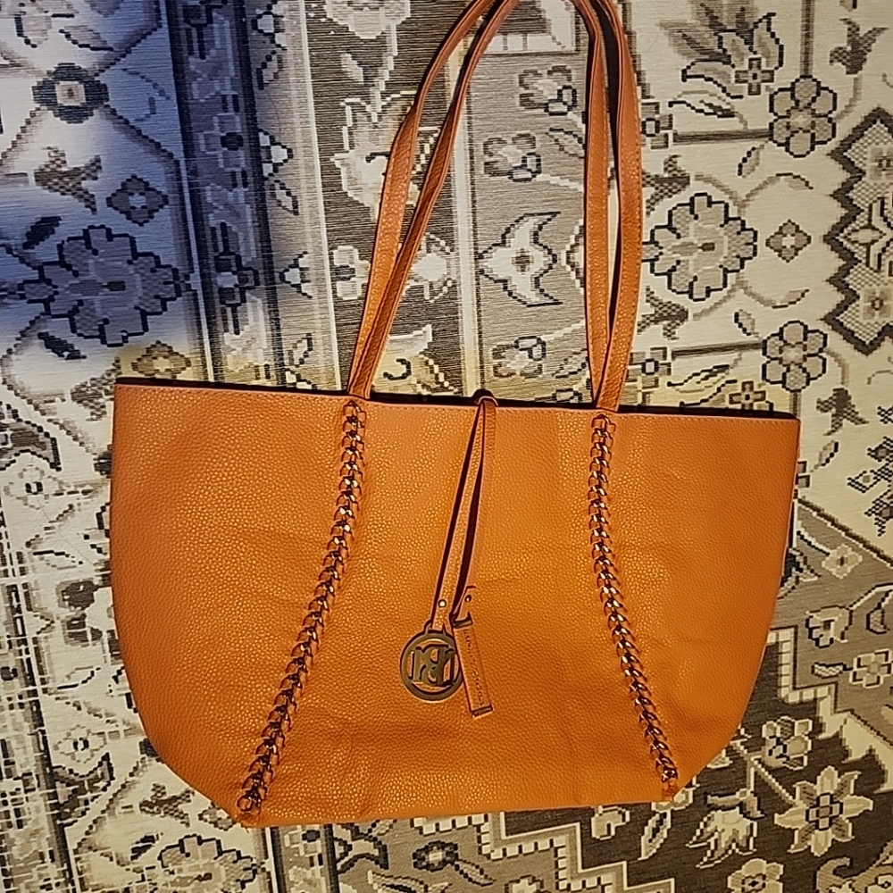 Badgley Mischka vegan leather orange tote with charm, chain link design,…